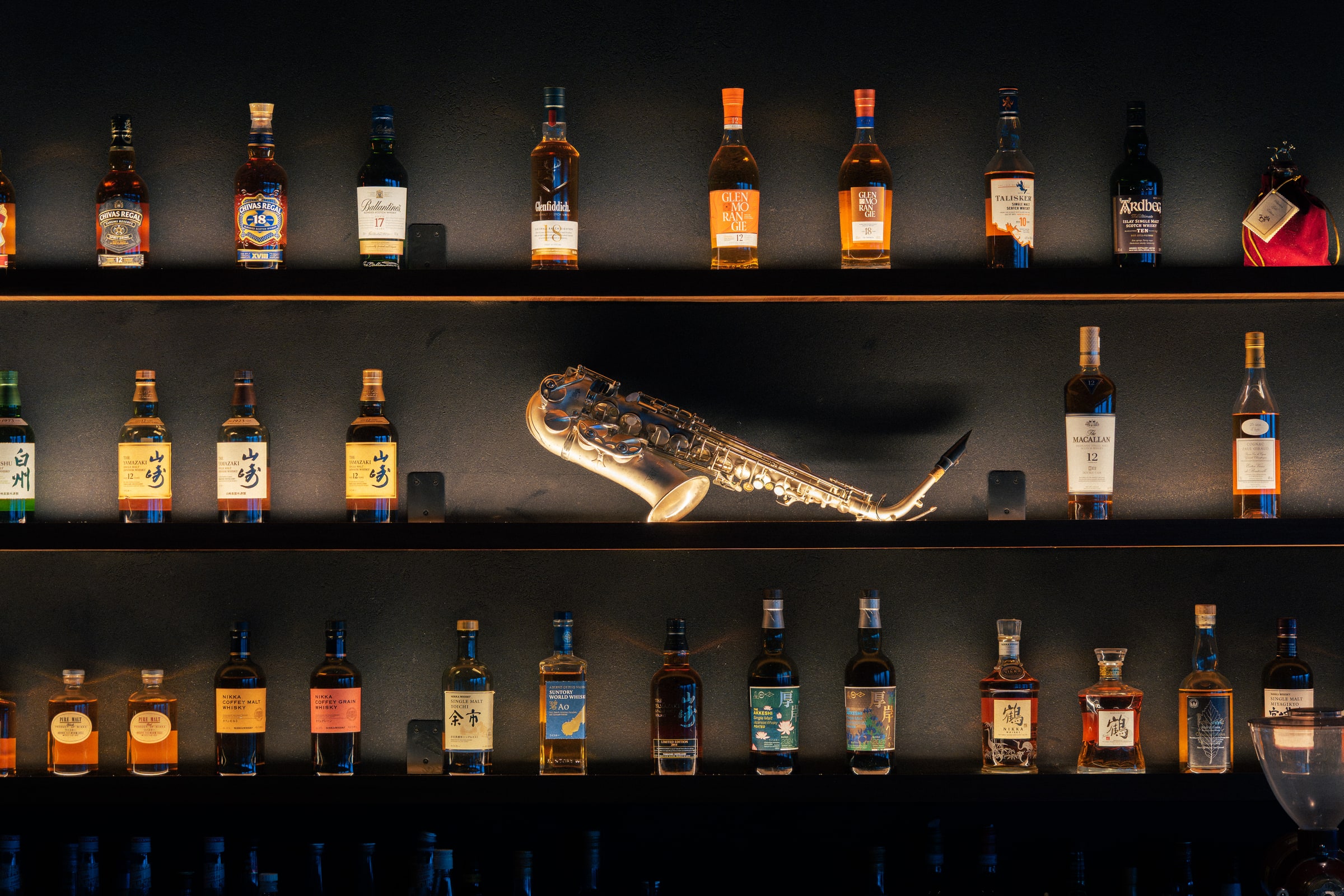 Whisky collection and saxophone at Raiden Bistro & Bar